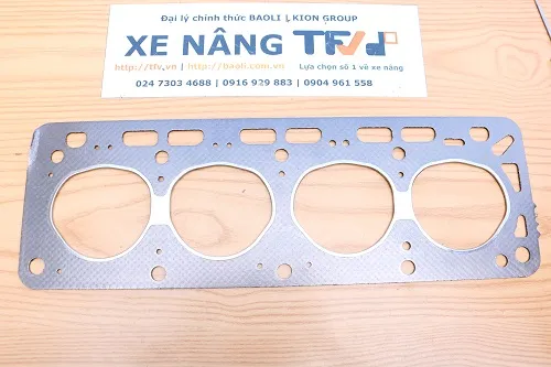 Gioăng mặt máy Nissan H15 với lỗ xi lanh, lỗ nước và lỗ dầu